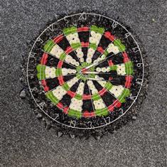 Dart board with darts